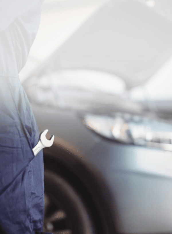 Mid-section of mechanic with a wrench tool in pocket Mid-section of mechanic with a wrench tool in pocket<br />